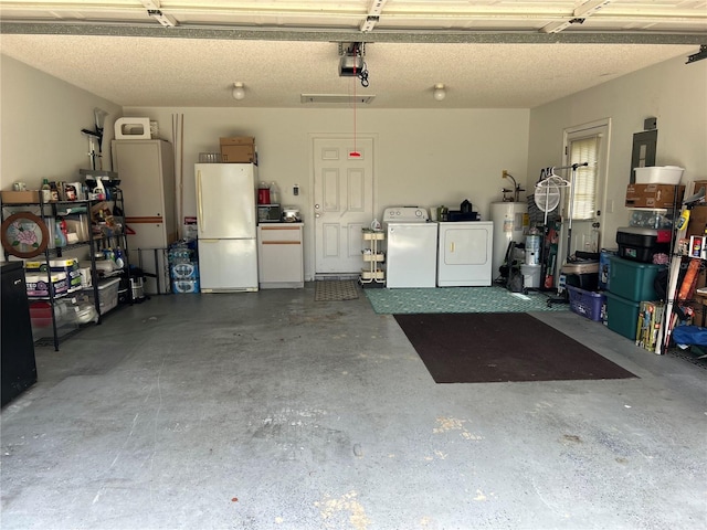 garage with white refrigerator, a garage door opener, water heater, and washing machine and clothes dryer