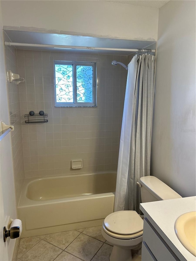 full bath featuring tile patterned flooring, vanity, toilet, and shower / bath combo