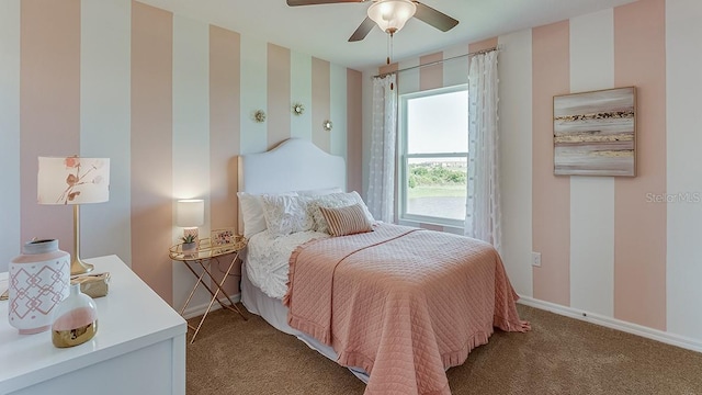 bedroom with ceiling fan and light carpet