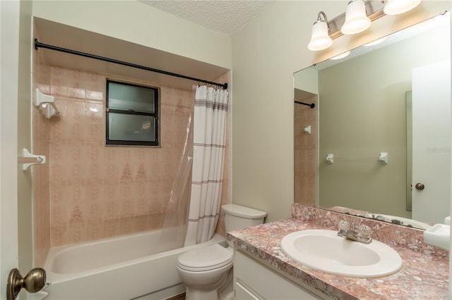 full bathroom featuring shower / tub combo with curtain, a textured ceiling, vanity, and toilet