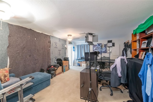 carpeted home office with a textured ceiling