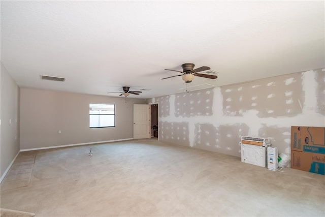 interior space featuring ceiling fan and light colored carpet