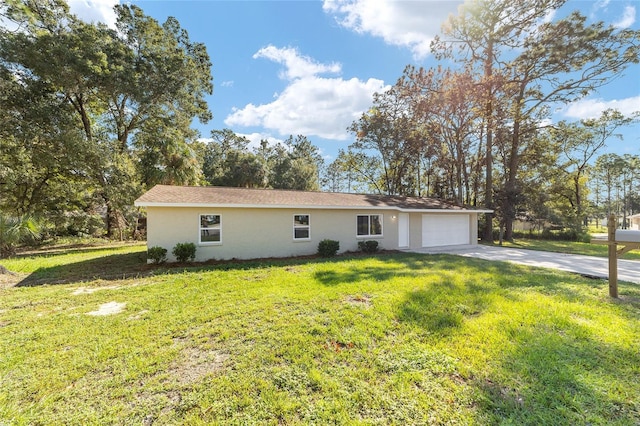 view of front of house featuring a garage and a front lawn