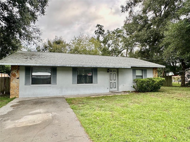 ranch-style house with a front lawn