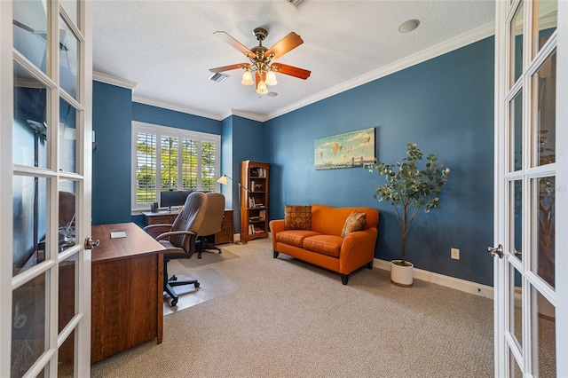 carpeted office space with ornamental molding and a textured ceiling