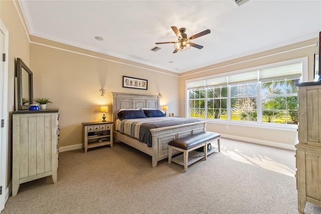 carpeted bedroom featuring crown molding and ceiling fan