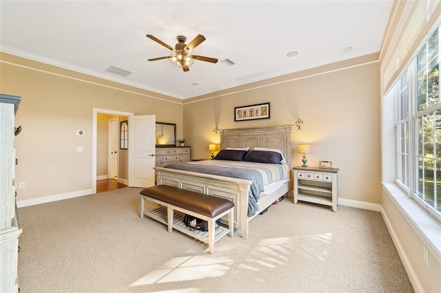 carpeted bedroom with crown molding and ceiling fan