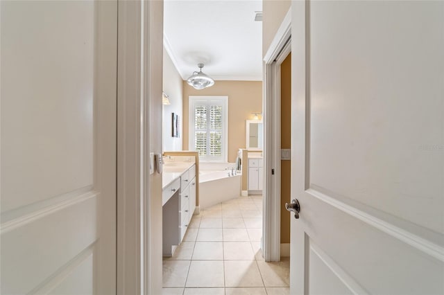 bathroom with vanity, ornamental molding, tile patterned floors, and a washtub