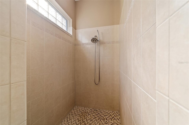 bathroom with tiled shower