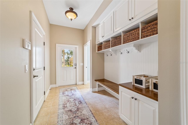 mudroom with light tile patterned floors