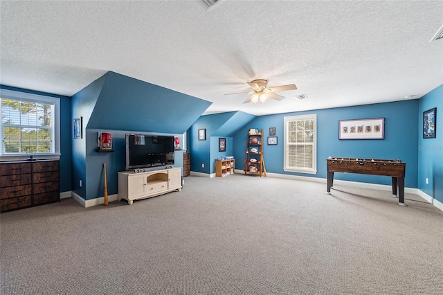 game room with ceiling fan, a textured ceiling, and carpet floors