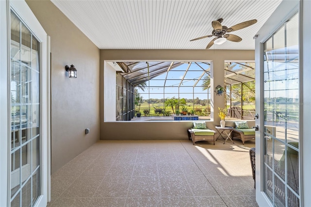 sunroom / solarium with ceiling fan