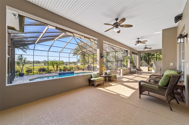 view of patio / terrace featuring a lanai and ceiling fan