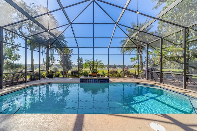 view of pool featuring a patio and a lanai