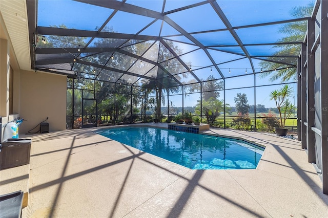 view of pool featuring a patio area and a lanai