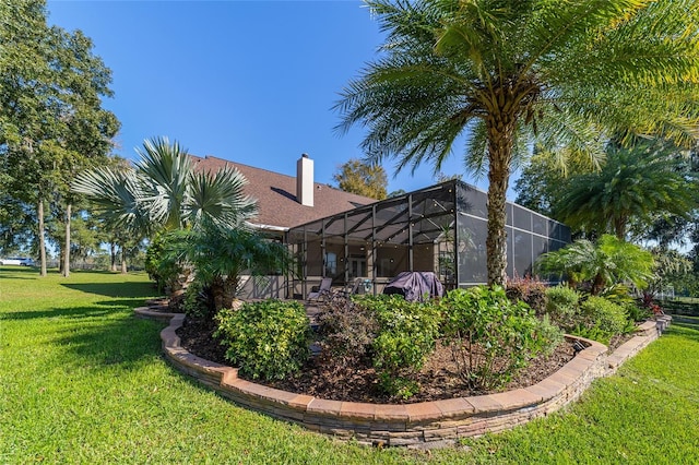 view of property exterior with a lanai and a lawn