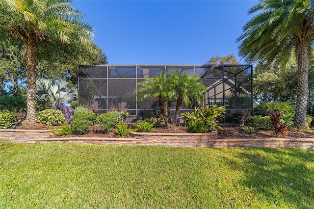 view of yard featuring glass enclosure