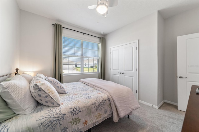 bedroom featuring a closet, ceiling fan, and light colored carpet