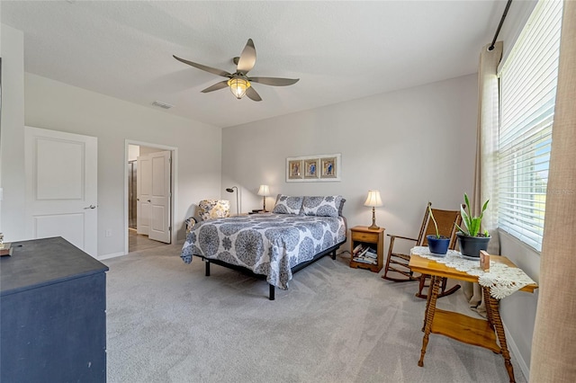 bedroom with ceiling fan and carpet flooring