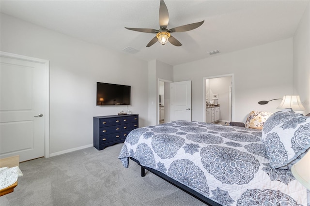 carpeted bedroom featuring ceiling fan and connected bathroom