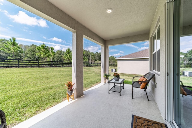 view of patio with a rural view