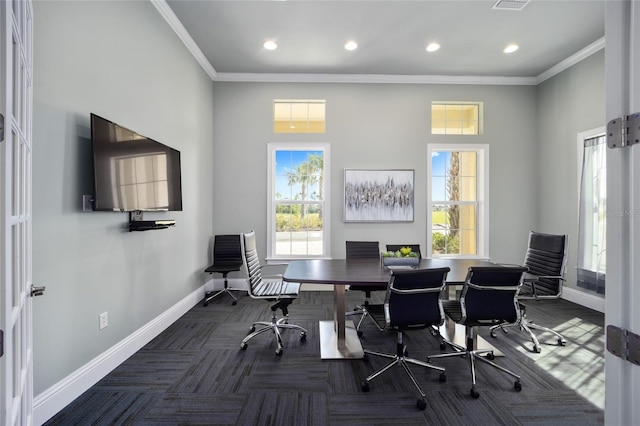 office featuring crown molding and a towering ceiling