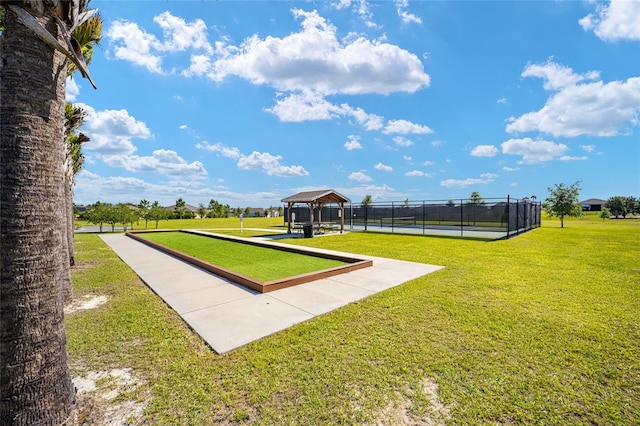 view of home's community with a gazebo and a yard