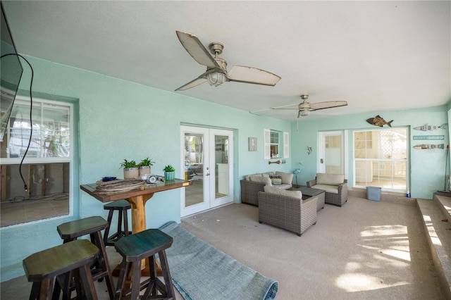 view of patio featuring ceiling fan and french doors