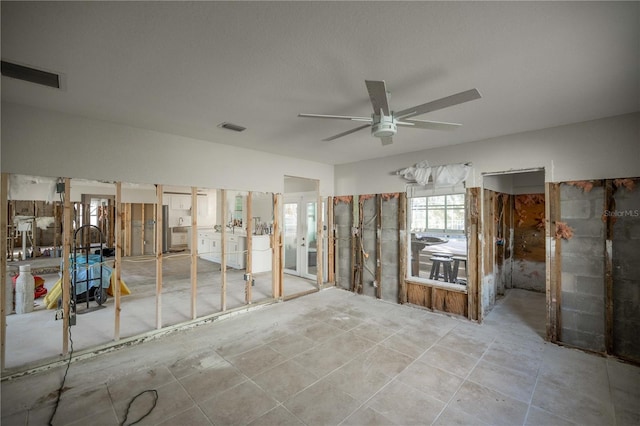 miscellaneous room featuring ceiling fan and light tile patterned floors