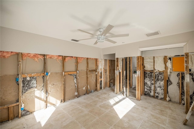 interior space with washer / clothes dryer and ceiling fan