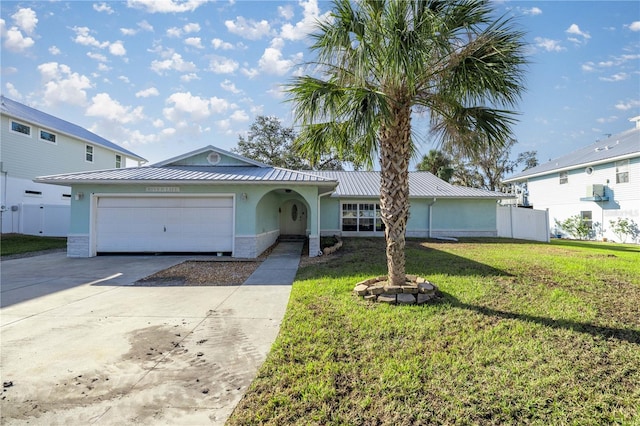 ranch-style house with a garage and a front yard