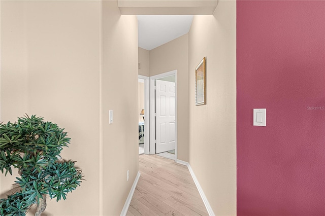 hallway with light wood-type flooring