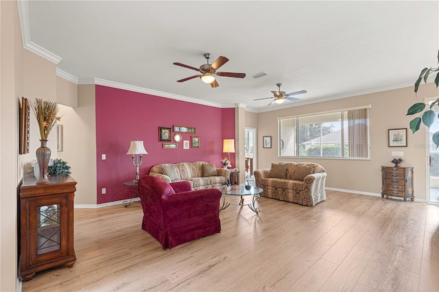 living room featuring visible vents, crown molding, light wood-style floors, and a ceiling fan