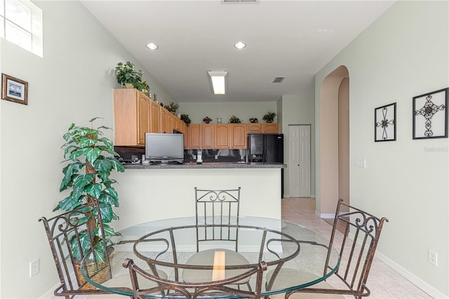 dining space with light tile patterned floors