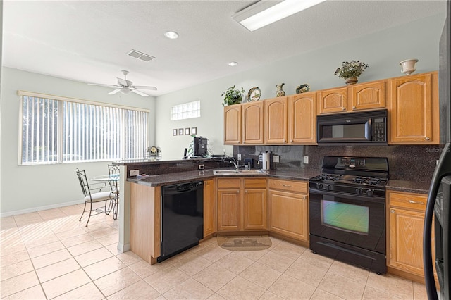 kitchen featuring backsplash, dark stone counters, black appliances, ceiling fan, and light tile patterned flooring