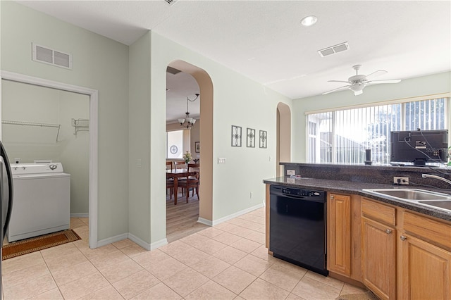 kitchen with ceiling fan with notable chandelier, sink, light tile patterned floors, black dishwasher, and washer / clothes dryer