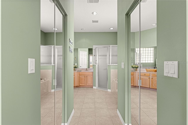 hallway featuring light tile patterned floors