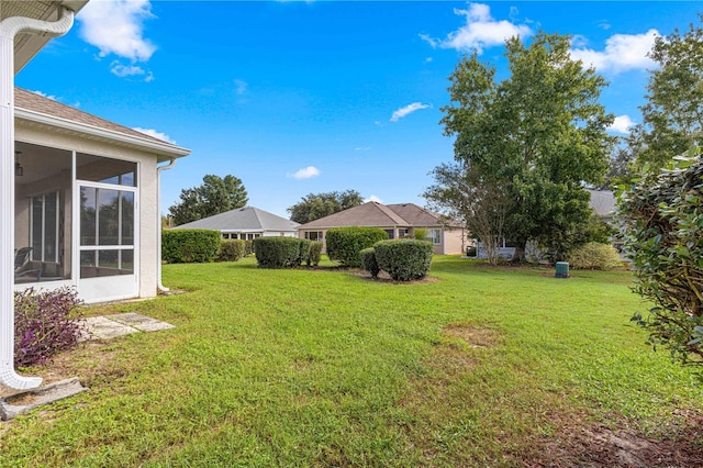 view of yard with a sunroom