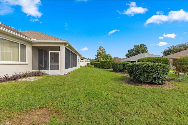 view of yard with a sunroom