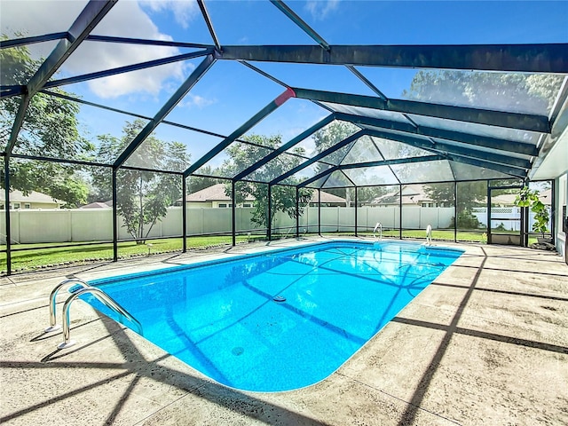 view of pool with a lanai and a patio area