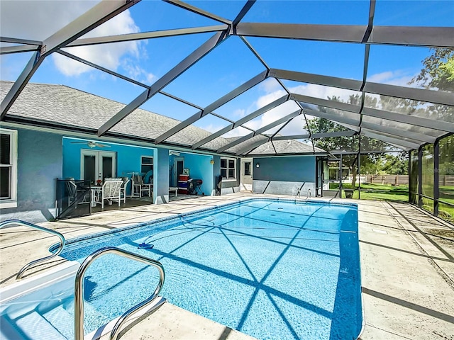 view of swimming pool with a lanai and a patio