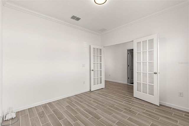 unfurnished room with french doors, light wood-type flooring, and ornamental molding