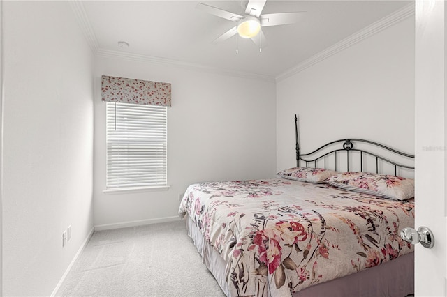 bedroom with ceiling fan, light colored carpet, and crown molding