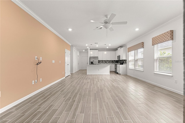 unfurnished living room with ceiling fan, ornamental molding, and light hardwood / wood-style floors