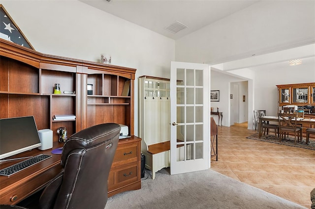 office featuring light carpet and french doors