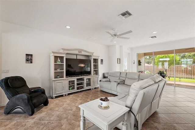 living room with ceiling fan and light tile patterned flooring