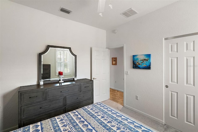 bedroom with ceiling fan and light colored carpet