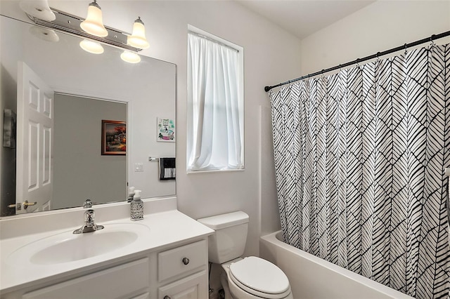 full bathroom with shower / tub combo, vanity, and toilet