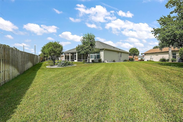 view of yard with a sunroom