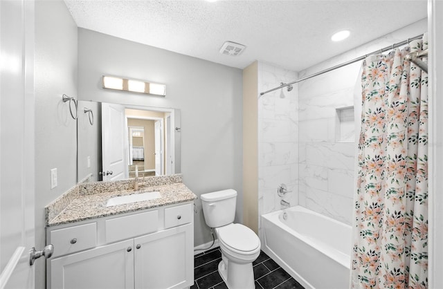 full bathroom featuring vanity, toilet, a textured ceiling, tile patterned flooring, and shower / tub combo with curtain